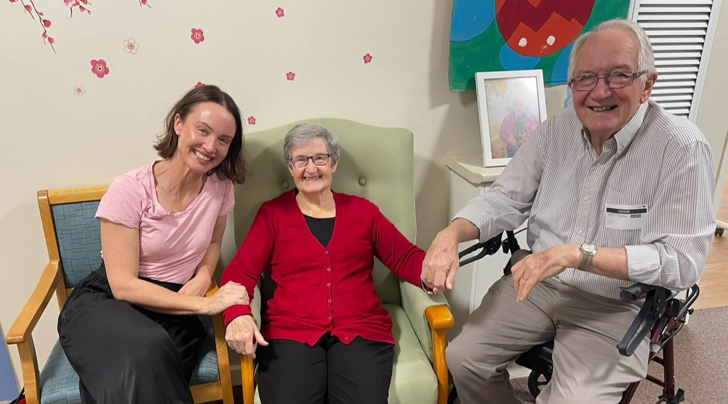 Bec is sitting with her mum, who has Alzheimer's, and her dad 