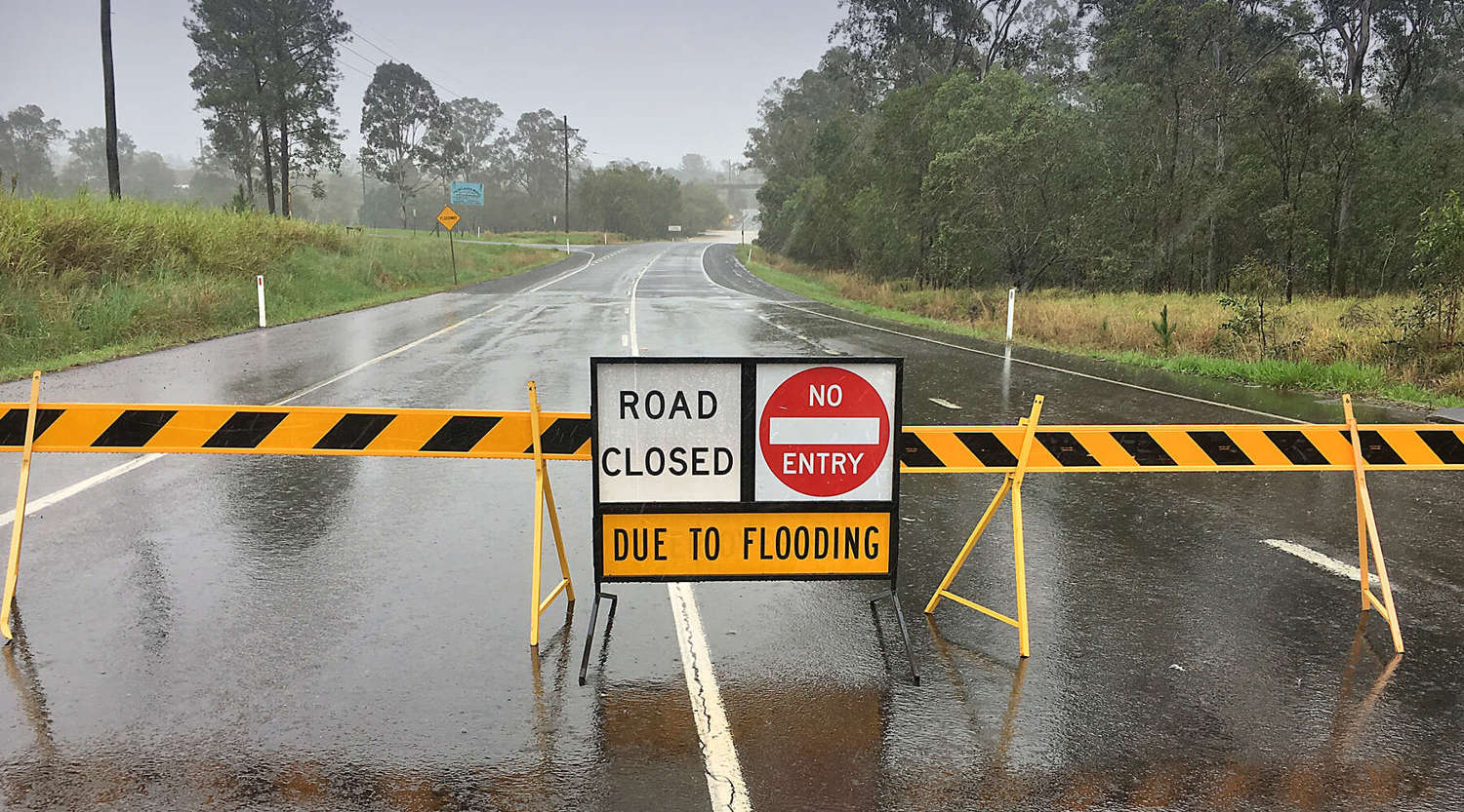 Road closed sign across road in Gympie Queensland due to flooding