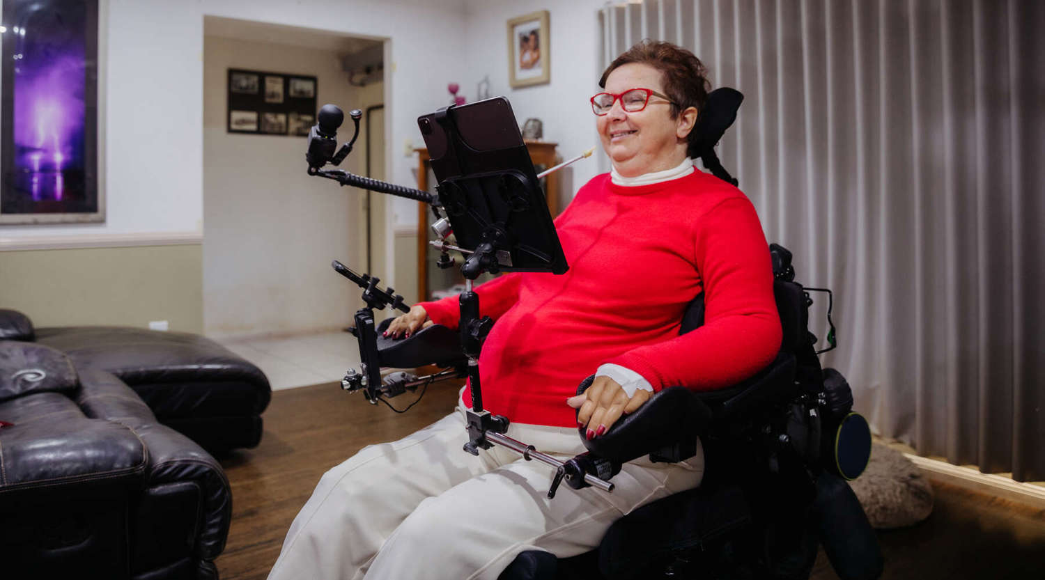 research participant Joanna Fowler in her home smiling