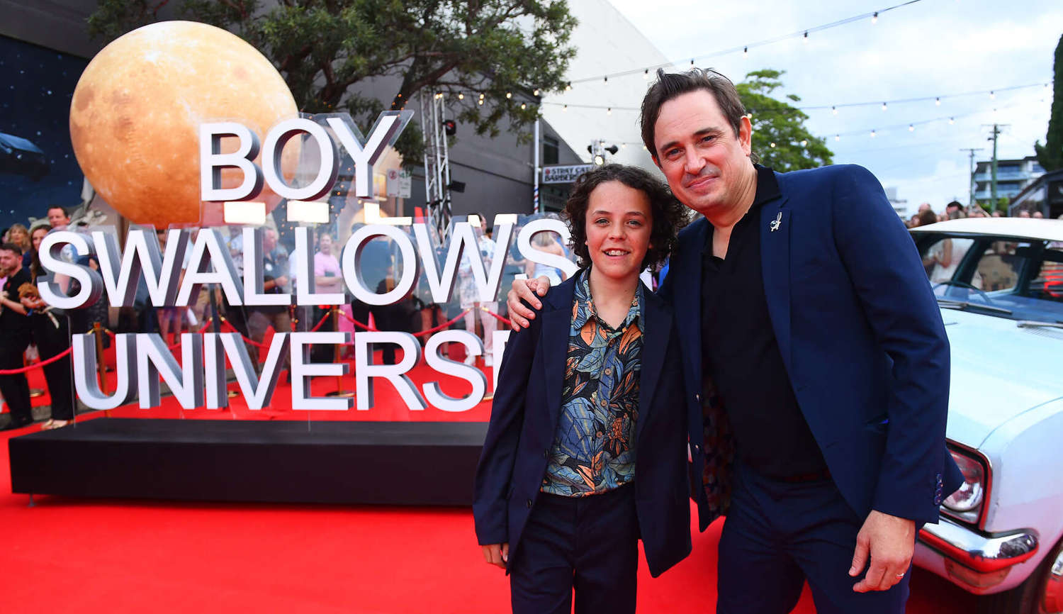 Boy Swallows Universe author Trent Dalton poses with actor Felix Cameron at premier of Netflix series - photo by Jono Searle