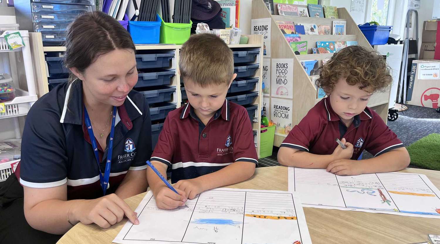 Belinda Delaney in the classroom with two children