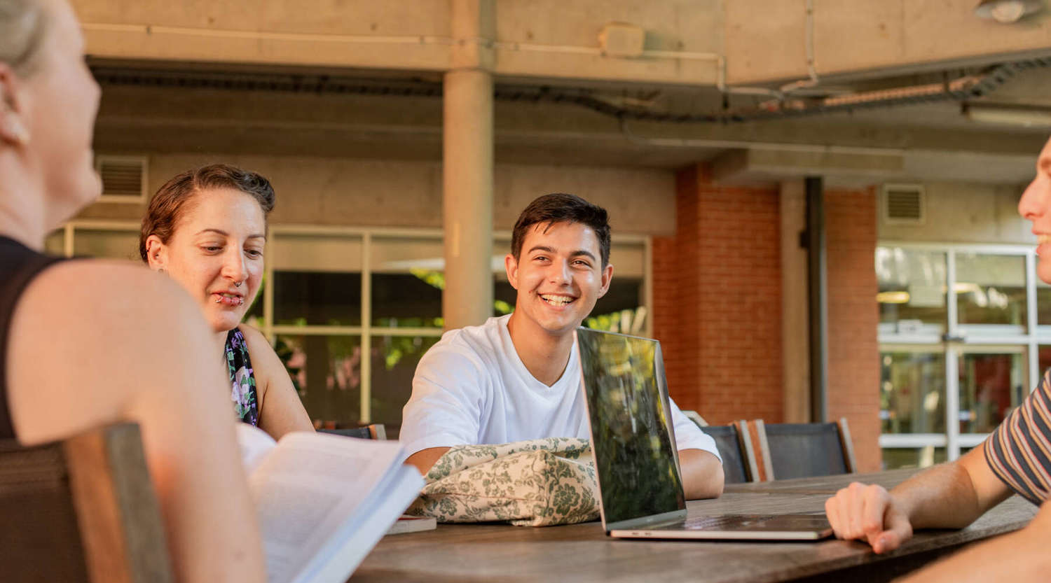 students on campus at a cafe