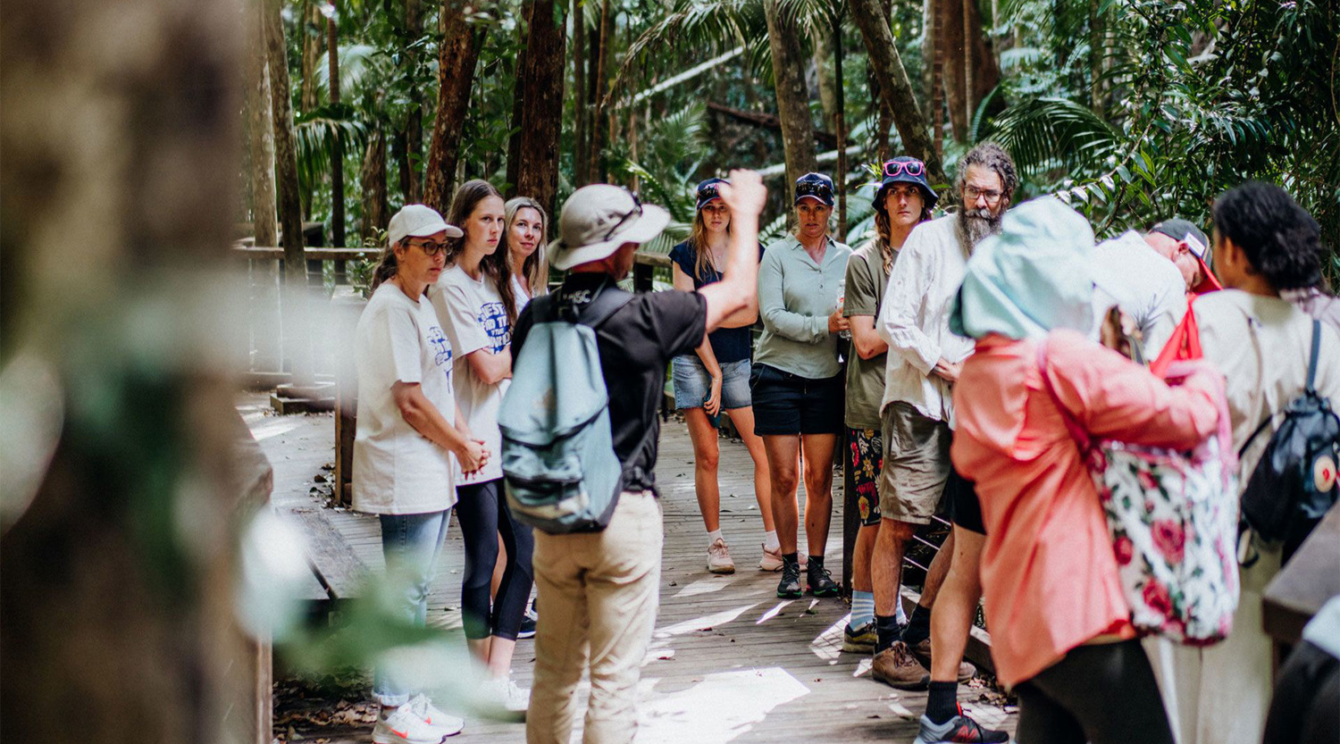 Academic shows students around K'gari